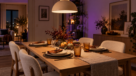 AI-generated concept: a Halloween dinner table with warm table lighting and a subtle purple wall accent