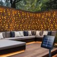 echosari warm solar curtain lights behind a patio sofa with panel