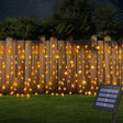 echosari warm solar curtain lights along a fence with panel