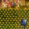 echosari warm solar net lights on a hedge with panel and holiday scene