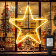echosari warm star outline light in a window with power adapter